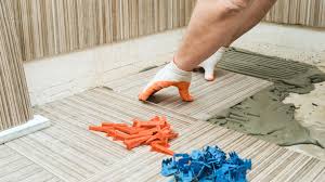 Pose de carrelage au sol par carreleur professionnel